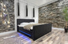 Luxuriöses Boxspringbett Oakland: LED-Beleuchtung, Kunstleder, 180x200 cm, H3 Komfort
